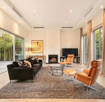 Inside living room of Homely townhouse listing with brown furniture